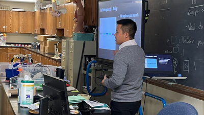 Yuepeng Soung, a biology teacher at Rufus King High School, prepares his freshmen for an electrophoresis lab.